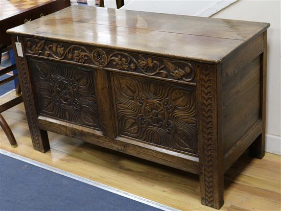 A 17th century style carved oak coffer W.114cm